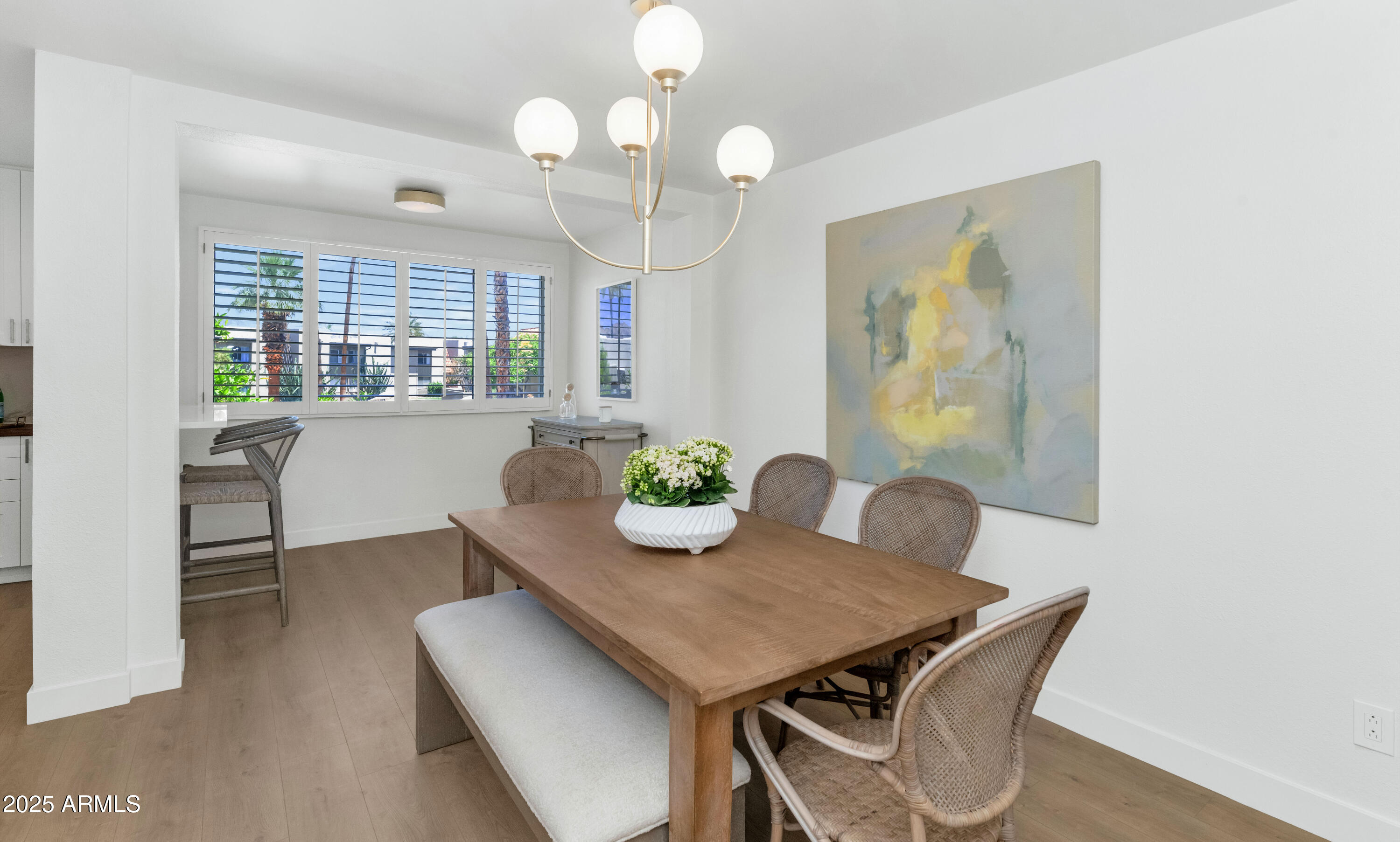 4201 East Camelback Road, Unit 70 Phoenix, AZ 85018 - Photo 10 of 36 a view of a dining room with furniture and window