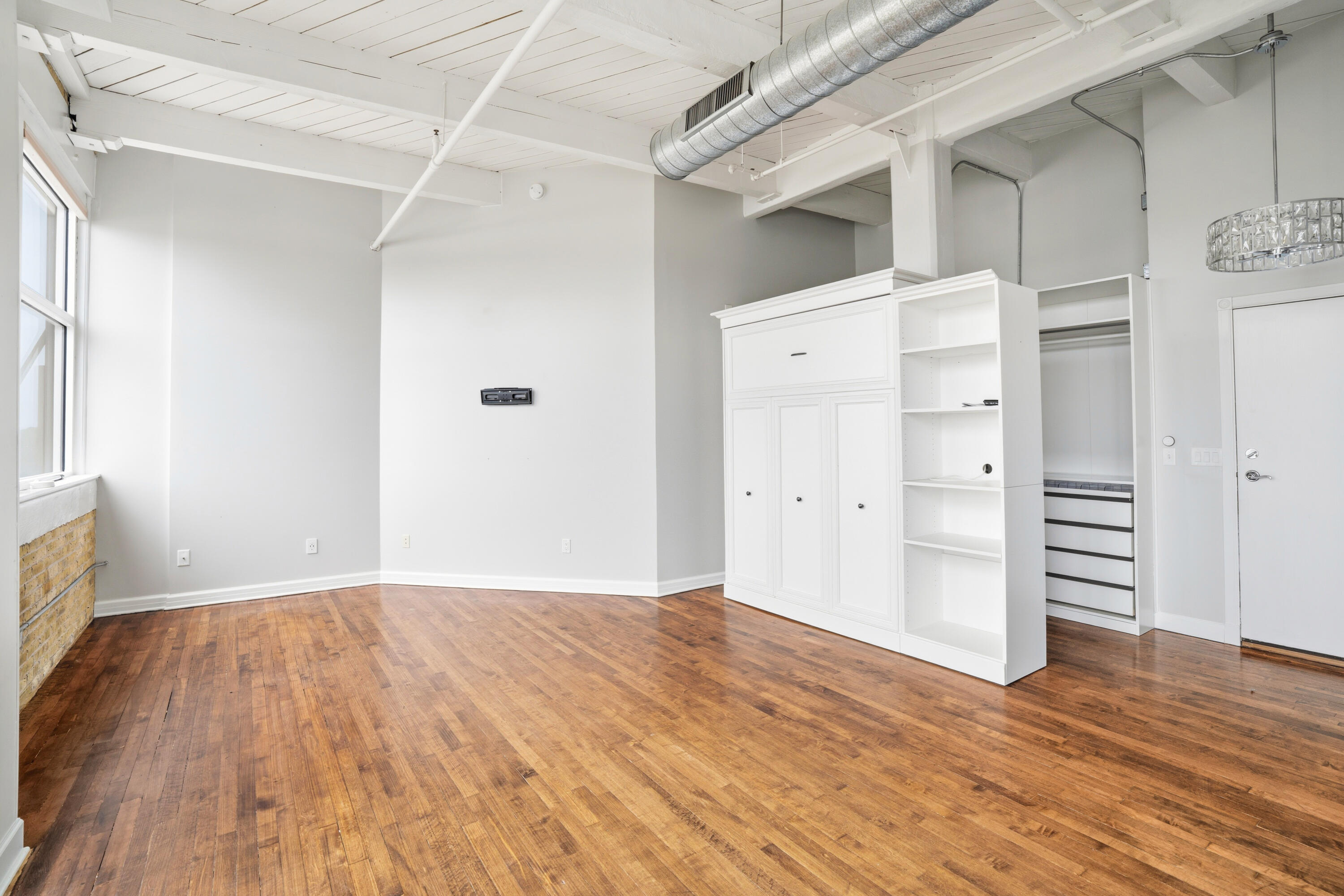 215 West Maple Street, Unit 607 Milwaukee, WI 53204 - Photo 5 of 20 Living Area/Murphy Bed
