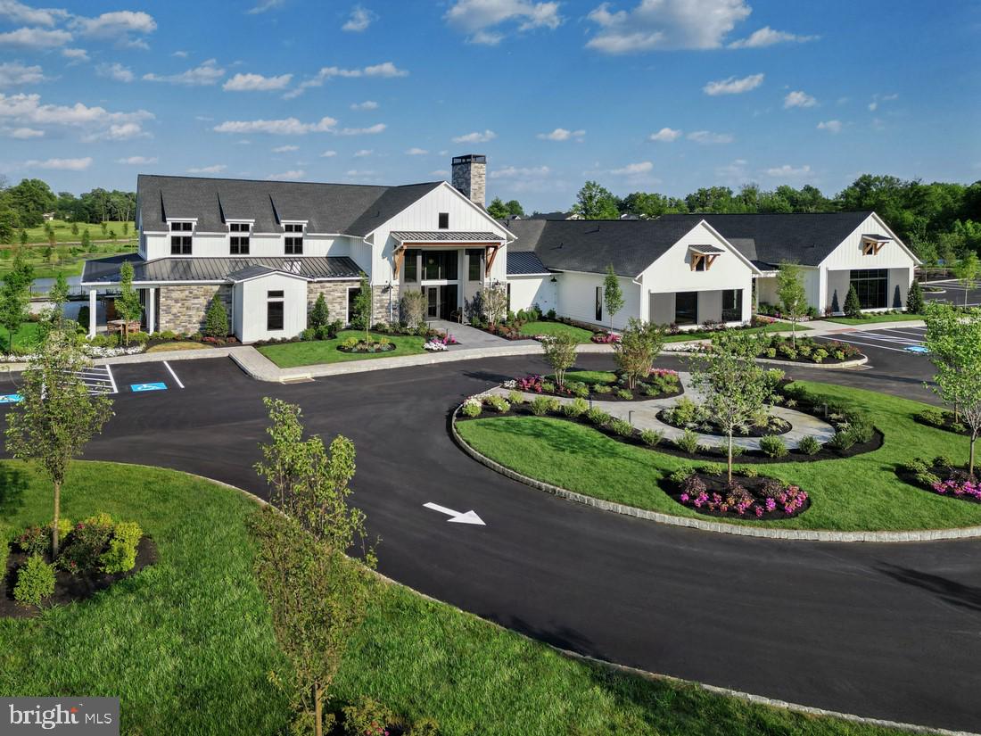 214 Gerry Way, Unit 249 Ambler, PA 19002 - Photo 16 of 38 a front view of a house with a yard