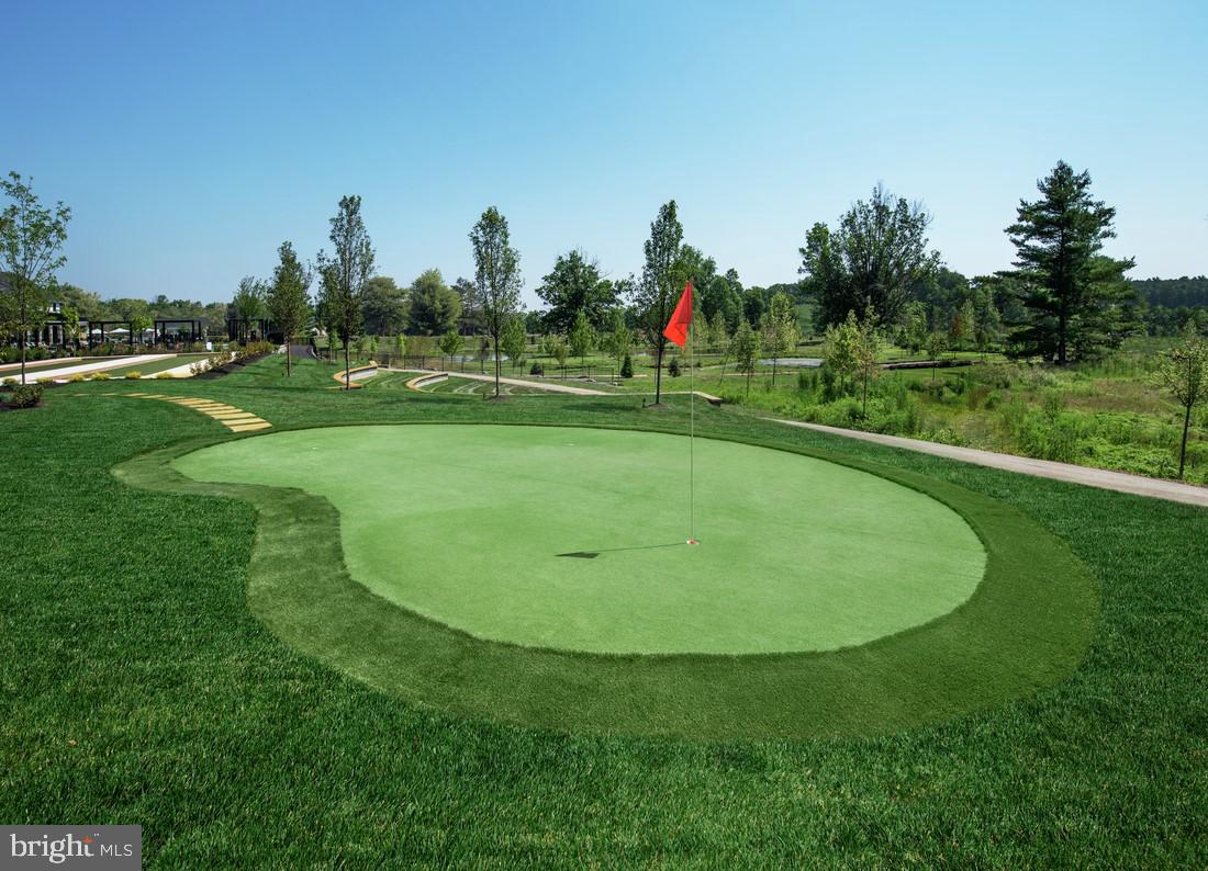 214 Gerry Way, Unit 249 Ambler, PA 19002 - Photo 30 of 38 a view of a golf course with a garden and trees