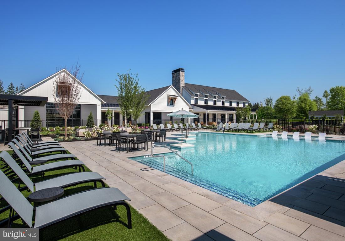214 Gerry Way, Unit 249 Ambler, PA 19002 - Photo 32 of 38 a view of a patio with swimming pool and chairs