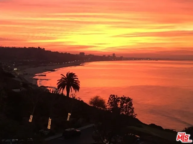 a view of a patio with a table and chairs