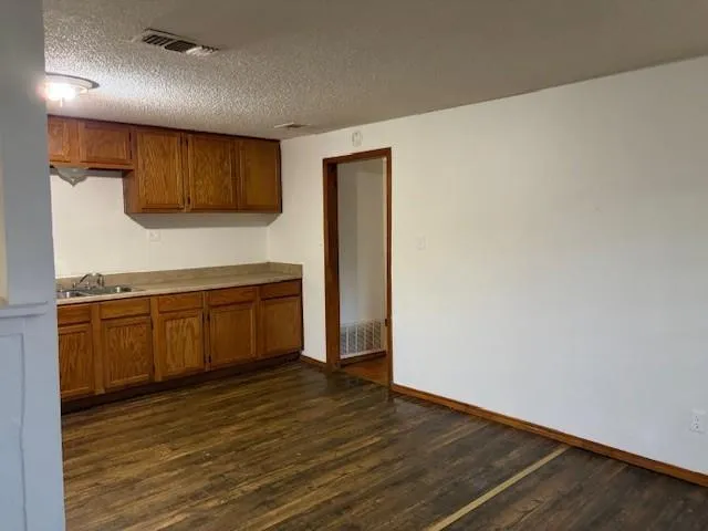 a view of a kitchen with microwave and stove