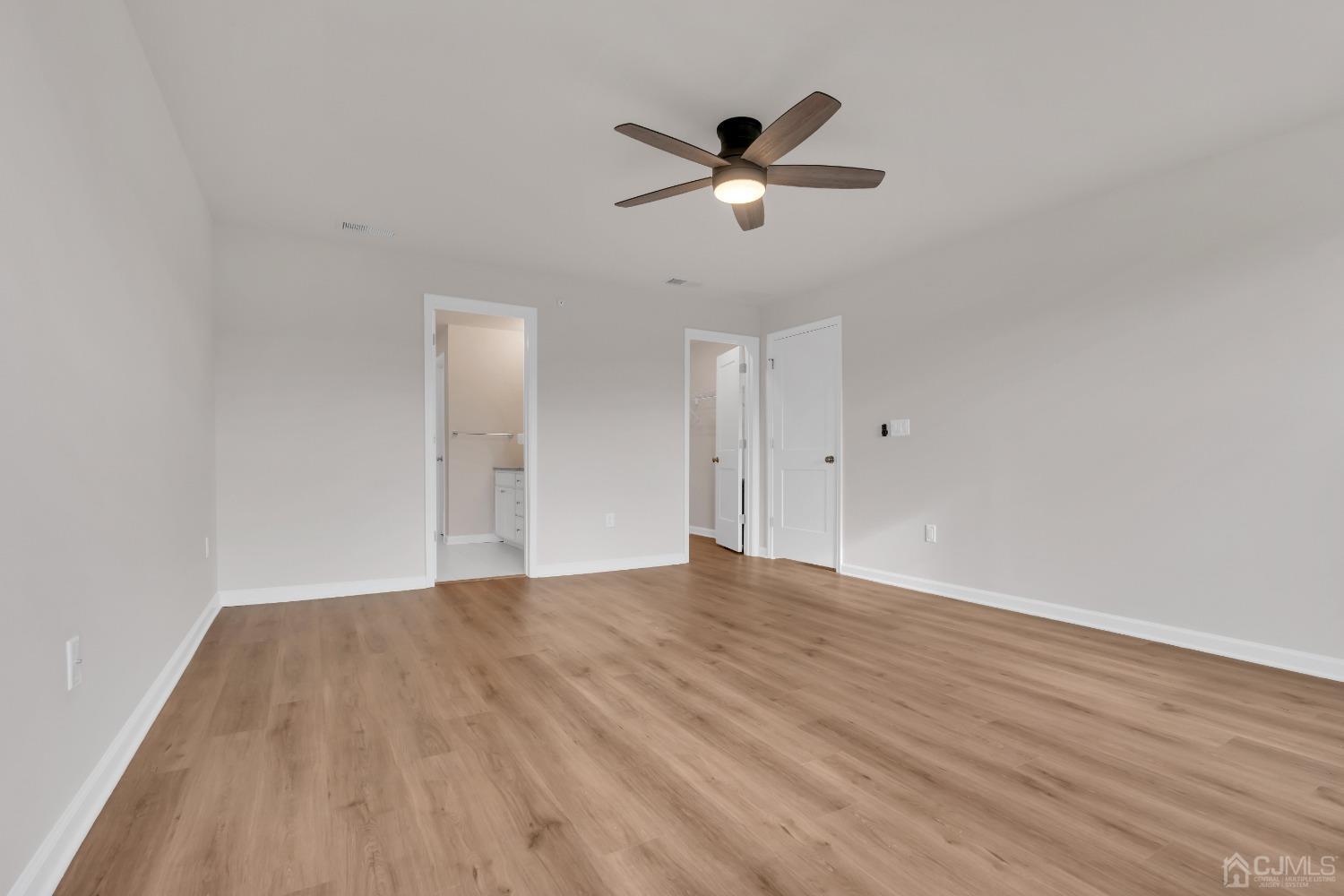 75 Depot Way Dunellen, NJ 08812 - Photo 13 of 28 a view of empty room with wooden floor and ceiling fan