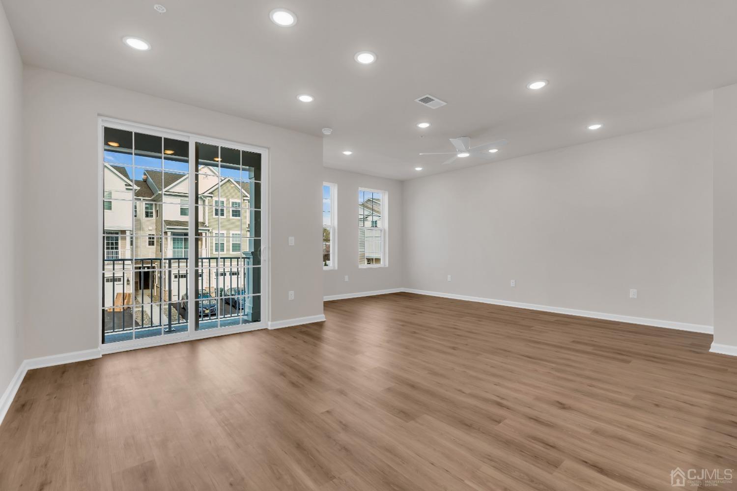 75 Depot Way Dunellen, NJ 08812 - Photo 4 of 28 a view of an empty room with wooden floor and a window