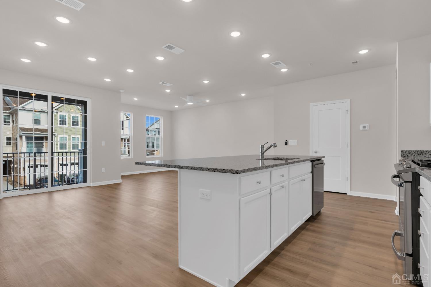 75 Depot Way Dunellen, NJ 08812 - Photo 7 of 28 a view of a large room with wooden floor