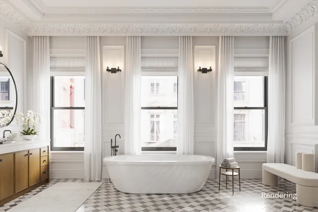 a bedroom with a bed a couch and a window