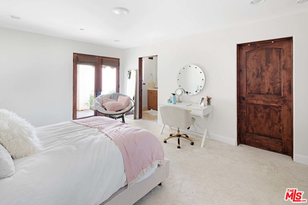 2251 Cold Canyon Road Calabasas, CA 91302 - Photo 25 of 47 a bedroom with a bed and furniture