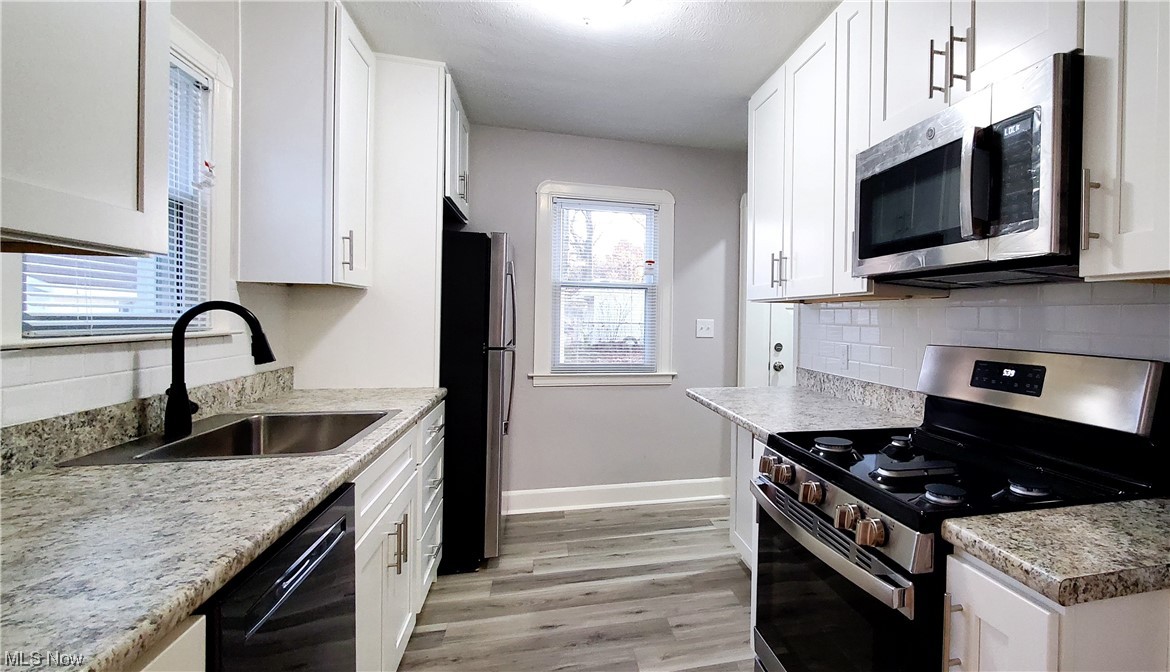 4348 Prasse Road South Euclid, OH 44121 - Photo 2 of 10 Fully remodeled kitchen with ample cabinet space and breakfast bar