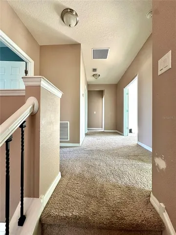 a view of a kitchen from the hallway