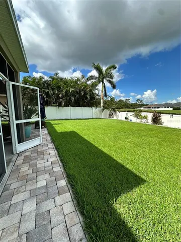 a view of a backyard with an outdoor space