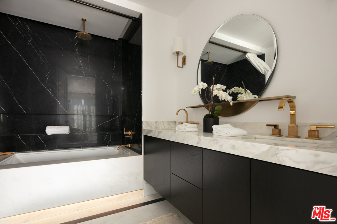 130 Roma Court Marina del Rey, CA 90292 - Photo 11 of 27 a bathroom with a sink and a mirror