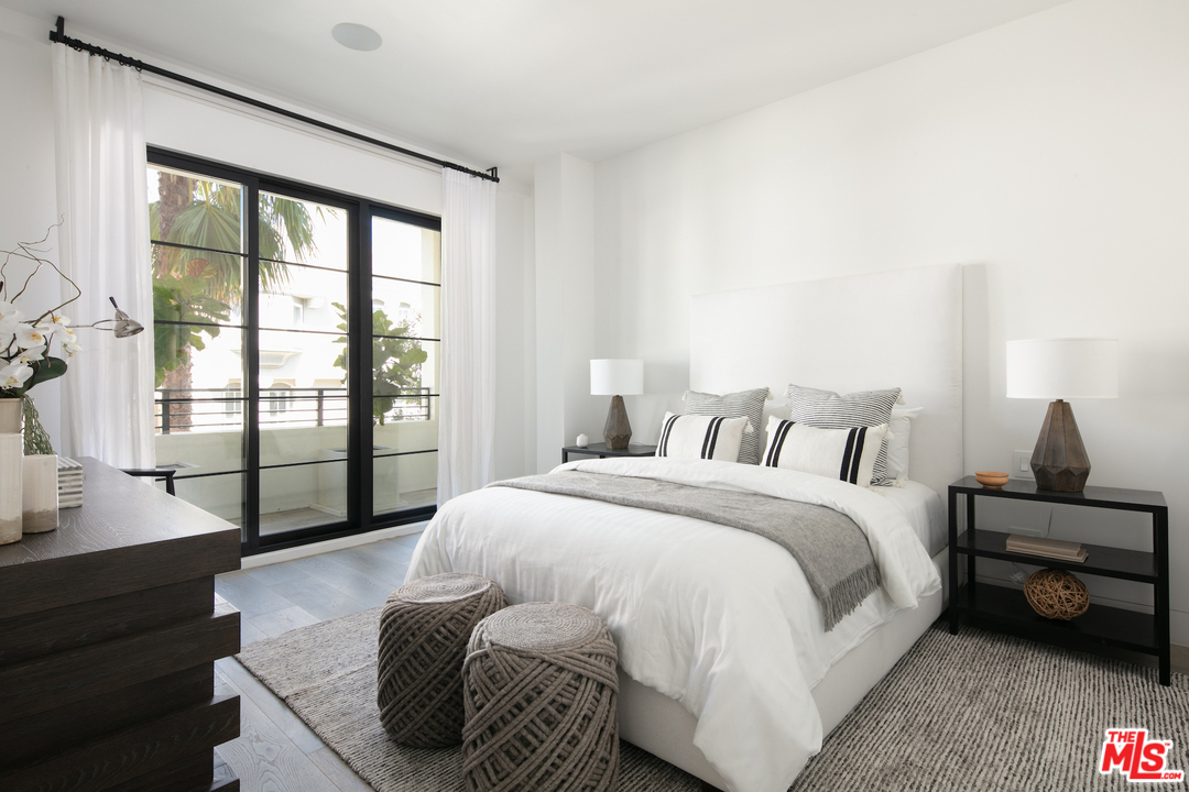 130 Roma Court Marina del Rey, CA 90292 - Photo 12 of 27 a bedroom with a bed and wooden floor