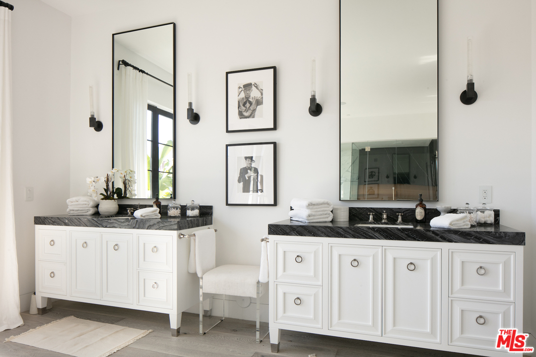 130 Roma Court Marina del Rey, CA 90292 - Photo 20 of 27 a bathroom with double sink and a mirror