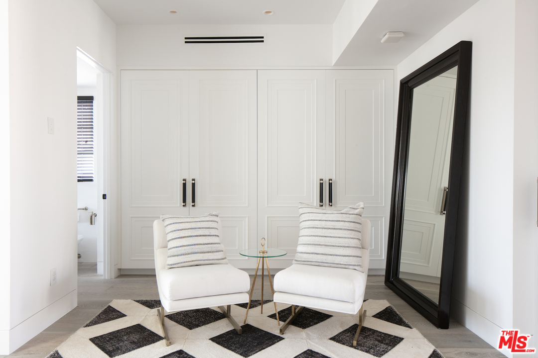 130 Roma Court Marina del Rey, CA 90292 - Photo 21 of 27 a view of a hallway with two washing machine and stairs