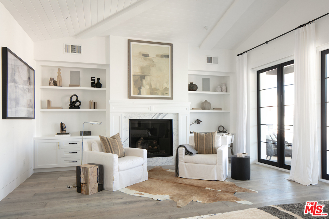130 Roma Court Marina del Rey, CA 90292 - Photo 24 of 27 a living room with furniture and a fireplace