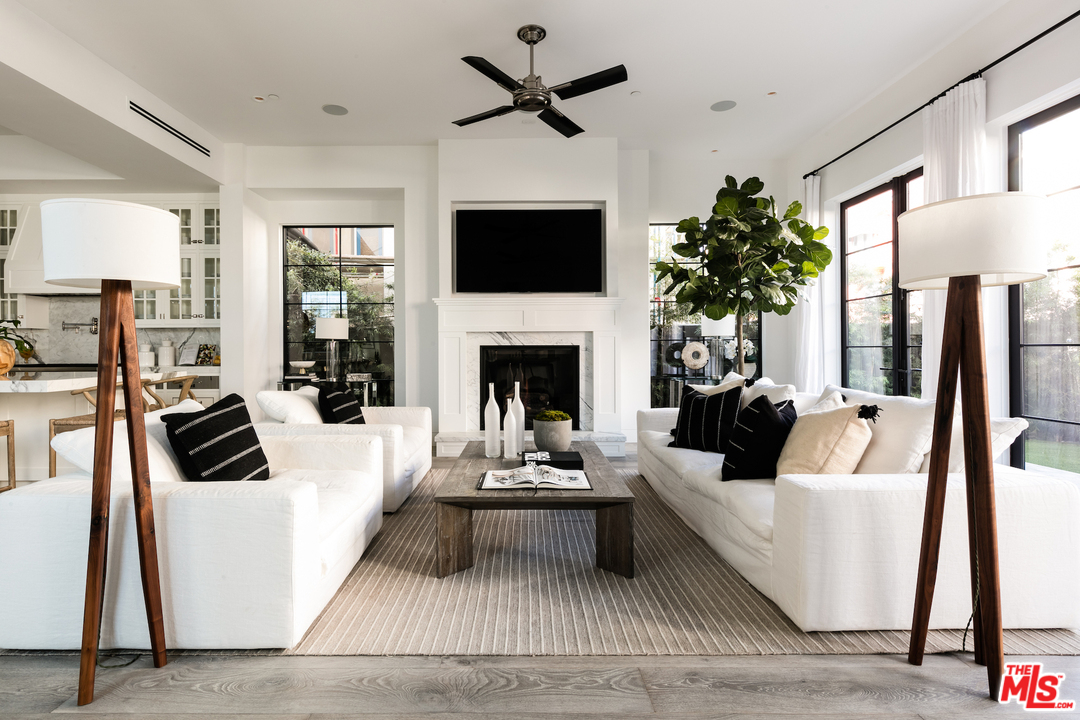 130 Roma Court Marina del Rey, CA 90292 - Photo 7 of 27 a living room with furniture fireplace and a flat screen tv