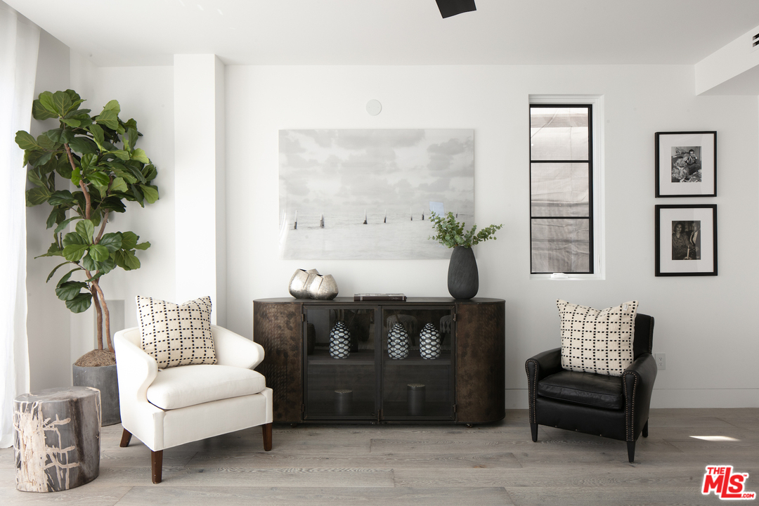 130 Roma Court Marina del Rey, CA 90292 - Photo 10 of 27 a living room with furniture and a potted plant