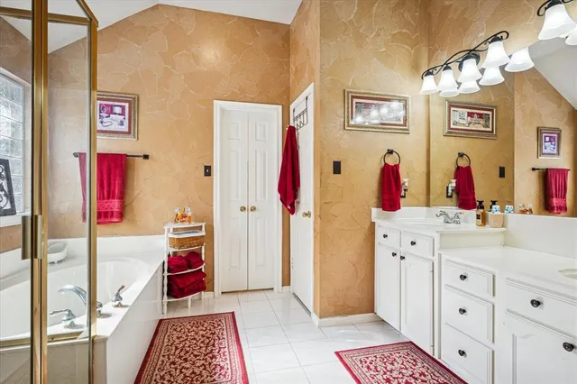 a bathroom with a sink vanity and a mirror