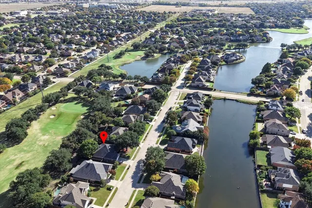 an aerial view of residential house with outdoor space and street view