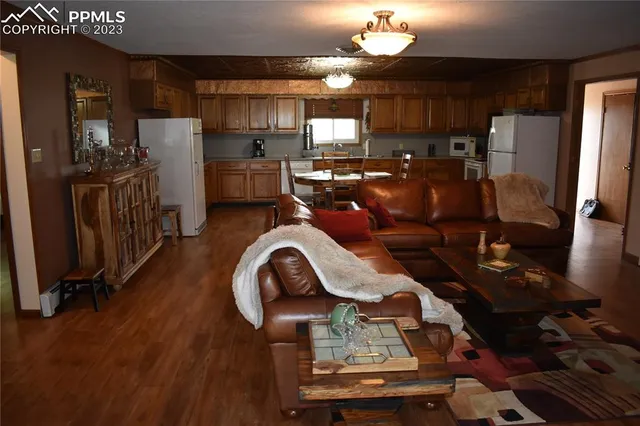 a kitchen with sink refrigerator and cabinets