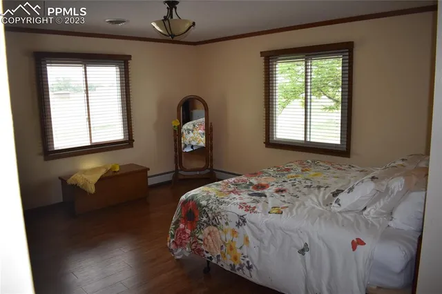 a bedroom with bed and window