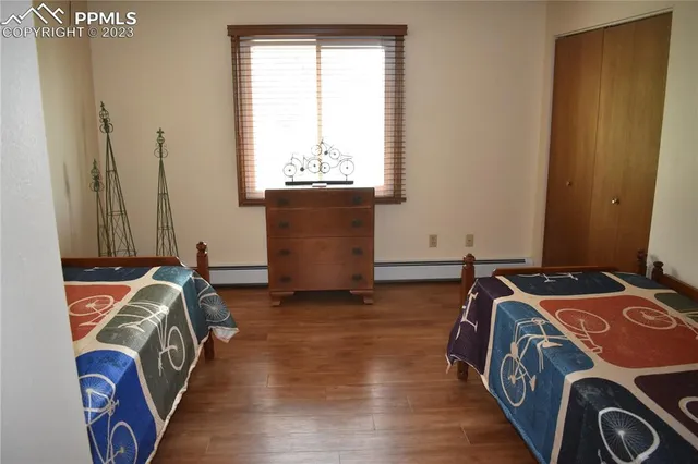 a bedroom with bed and a window