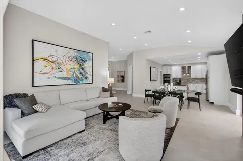 a kitchen with stainless steel appliances granite countertop a refrigerator sink and cabinets