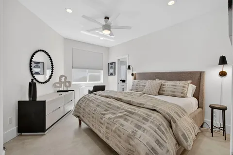 a bathroom with a toilet sink and shower