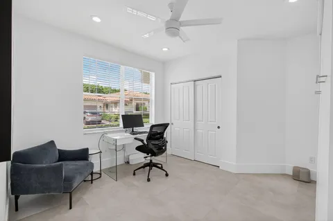 a view of a house with backyard and plants