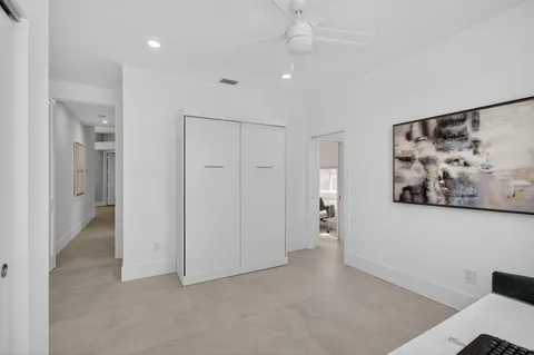 a kitchen with a table and chairs in it