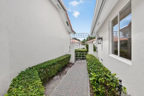 a living room with furniture a large window and a flat screen tv