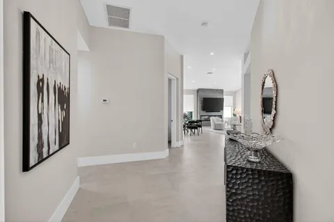 a living room with furniture a rug and a flat screen tv