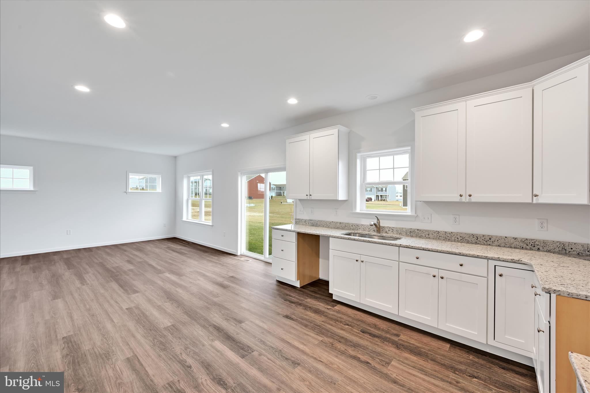 10659 Jonestown Road Annville, PA 17003 - Photo 13 of 32 a kitchen with granite countertop white cabinets and wooden floor