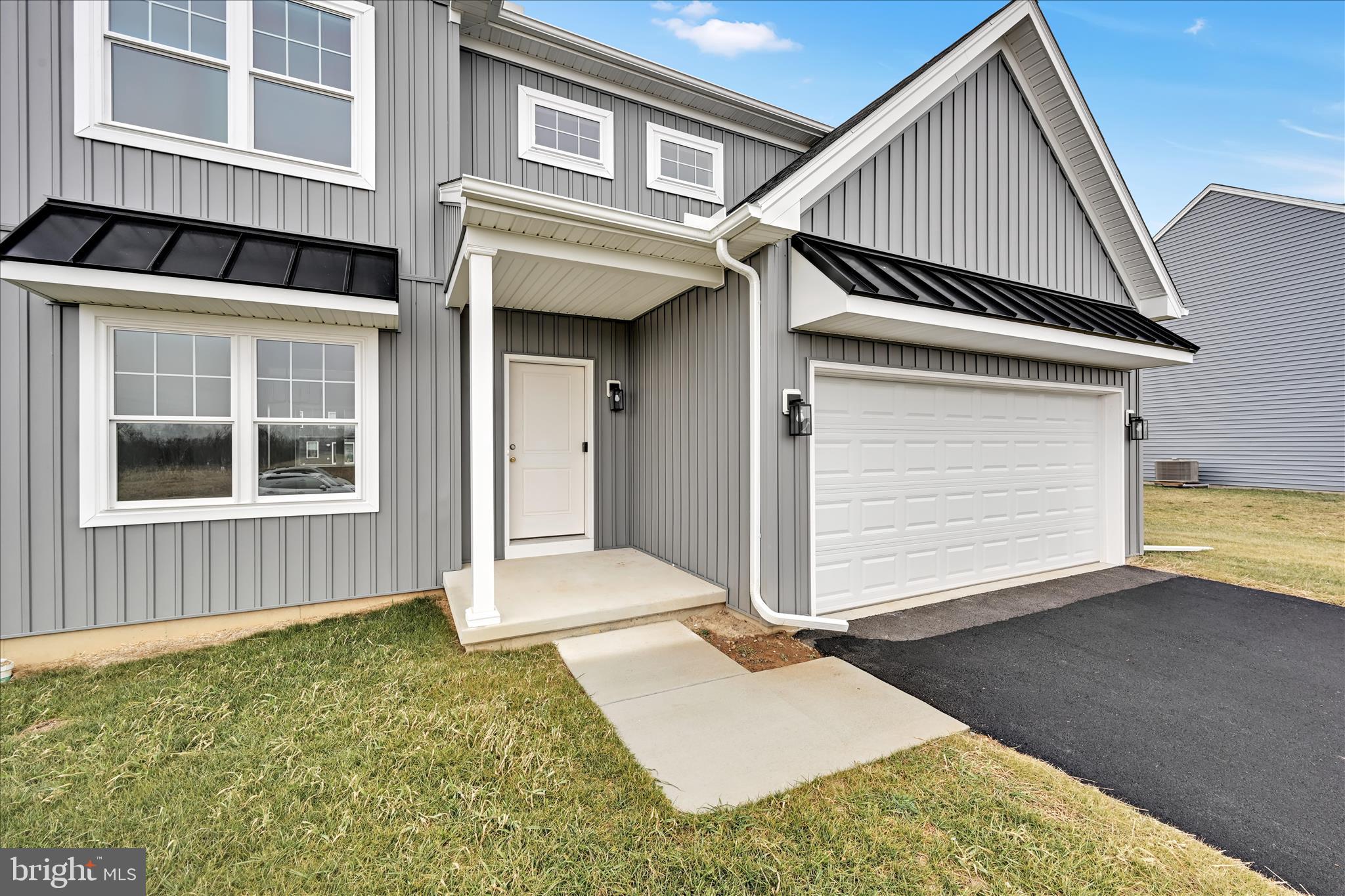 10659 Jonestown Road Annville, PA 17003 - Photo 4 of 32 a front view of a house with a garage