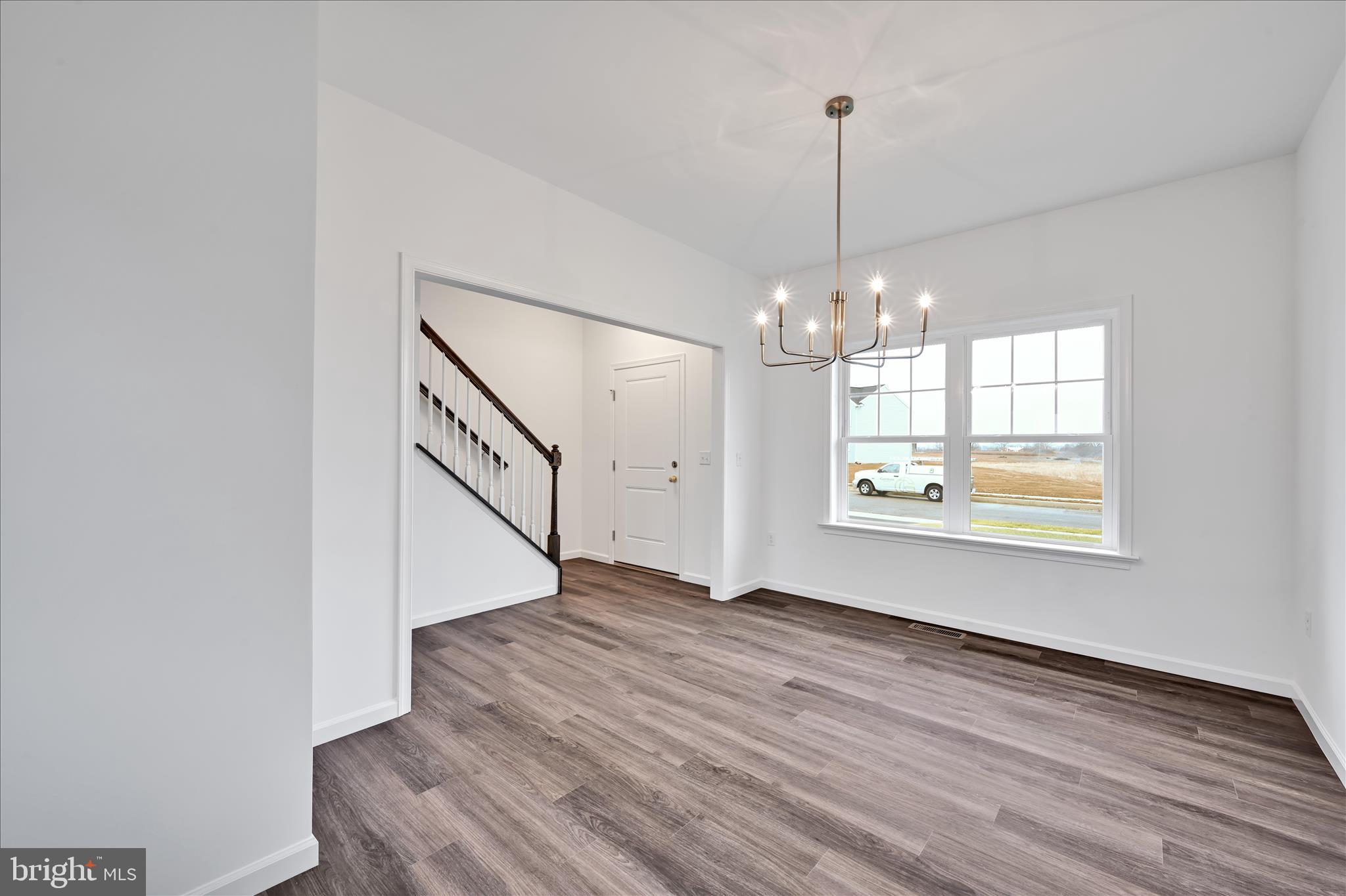 10659 Jonestown Road Annville, PA 17003 - Photo 6 of 32 a view of an empty room with window and wooden floor
