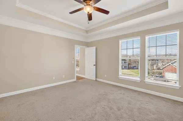 a bathroom with a tub a sink and mirror