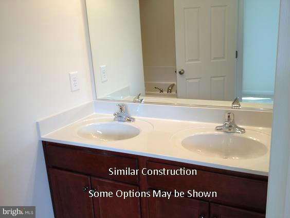 1136 Stallion Street Ranson, WV 25438 - Photo 12 of 23 a bathroom with a sink and a mirror