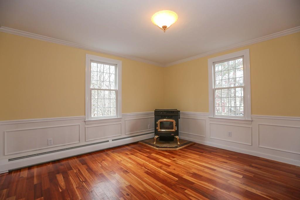 323 Sugar Road Bolton, MA 01740 - Photo 11 of 35 a view of empty room with wooden floor and fan