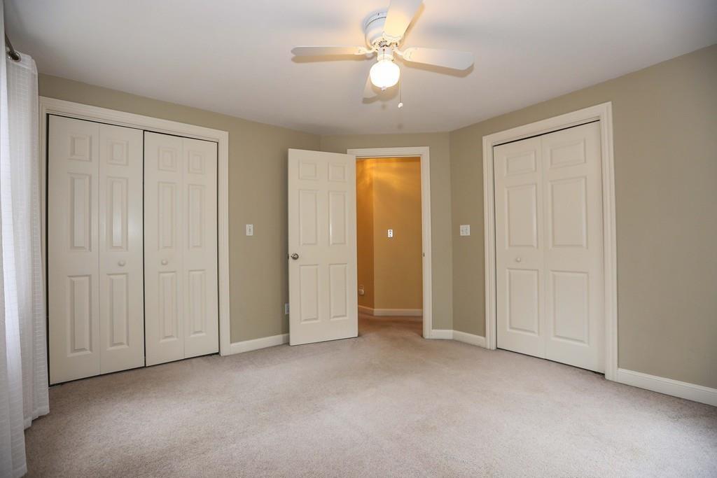 323 Sugar Road Bolton, MA 01740 - Photo 15 of 35 an empty room with closet and a ceiling fan