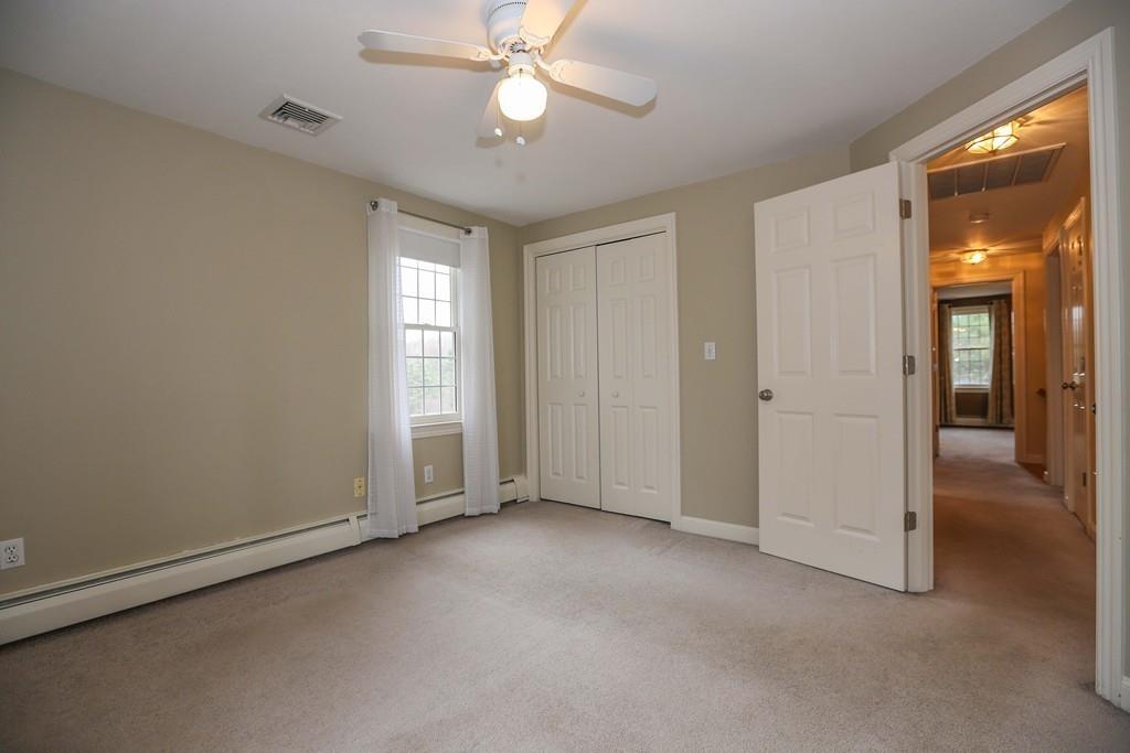 323 Sugar Road Bolton, MA 01740 - Photo 16 of 35 an empty room with fan and entrance