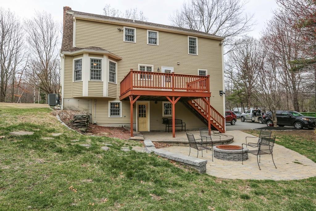 323 Sugar Road Bolton, MA 01740 - Photo 32 of 35 a view of a house with a yard