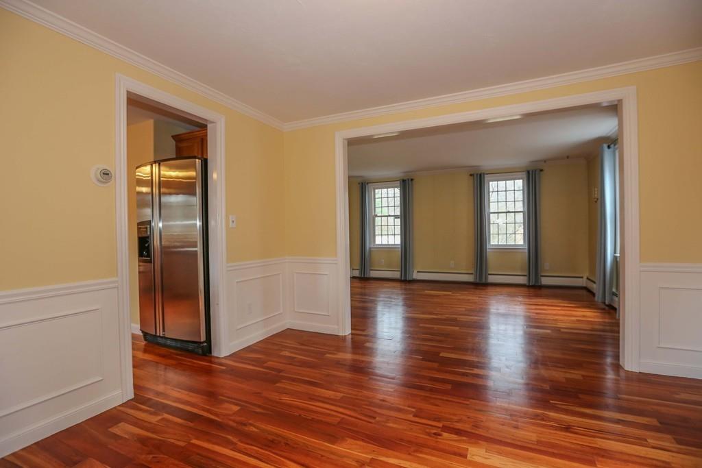 323 Sugar Road Bolton, MA 01740 - Photo 8 of 35 an empty room with wooden floor and closet