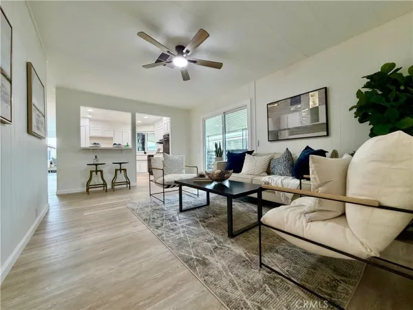 a bedroom with a bed and ceiling fan