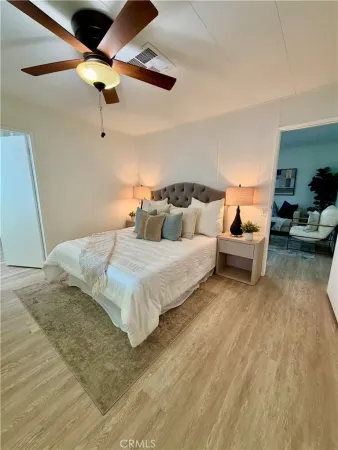 a bedroom with bed and window