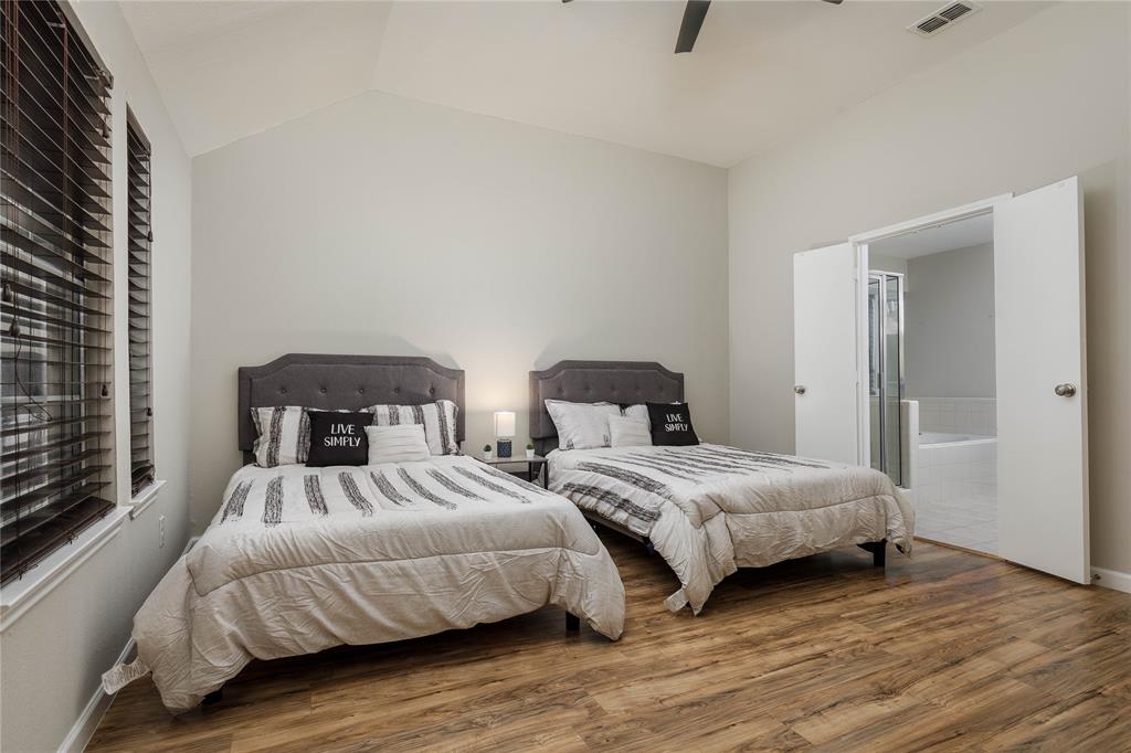 4108 Fryer Street The Colony, TX 75056 - Photo 16 of 27 a bedroom with two beds and painted walls