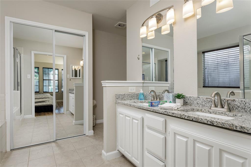 4108 Fryer Street The Colony, TX 75056 - Photo 17 of 27 a en suite bathroom with a double vanity sink and a mirror