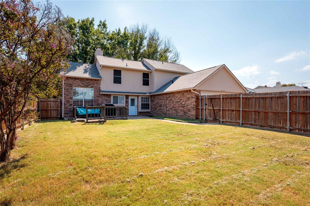 4108 Fryer Street The Colony, TX 75056 - Photo 26 of 27 a front view of a house with a yard and swimming pool