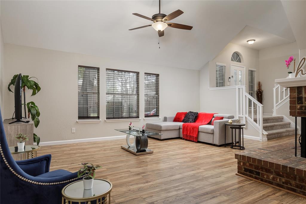 4108 Fryer Street The Colony, TX 75056 - Photo 8 of 27 a living room with furniture chess board and a large window