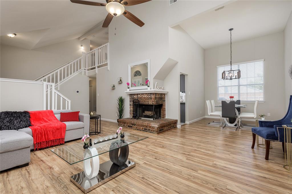 4108 Fryer Street The Colony, TX 75056 - Photo 9 of 27 a living room with furniture and a fireplace